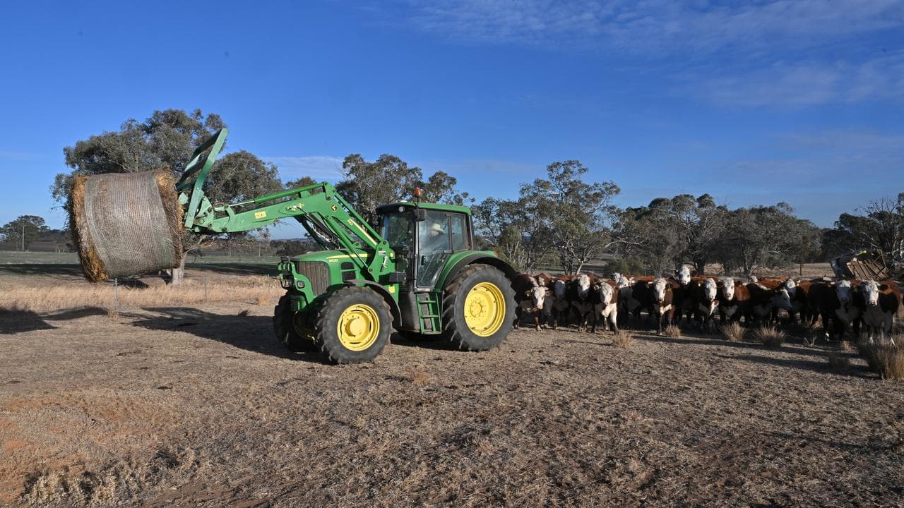 A tractor with hay on a drought-affected farm near Cootamundra, NSW