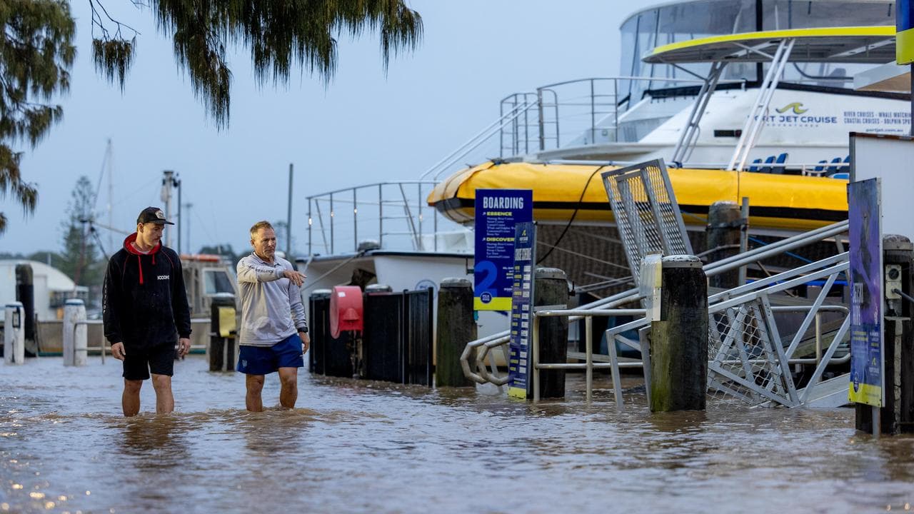 Conor Lang and Anthony Heeney from Port Jet Cruizes in flooding