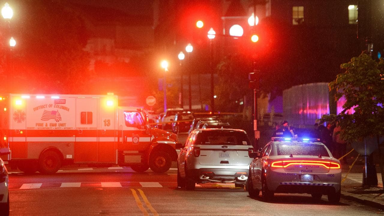 Law enforcement work the scene after a double shooting in Washington
