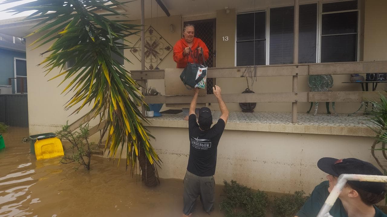 Jo Sharpe receives some supplies from Port Macquarie local David Henry