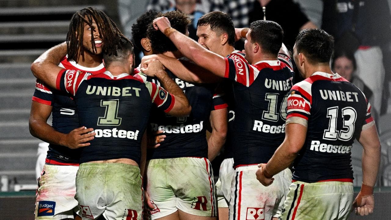 Celebrating Sydney Roosters teammates.