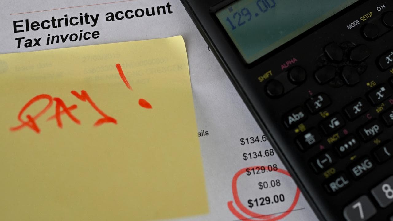 Photo illustration of an electricity bill with a calculator