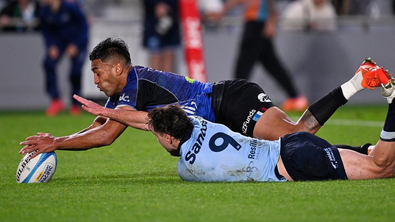 Blues centre Rieko Ioane scores a try.
