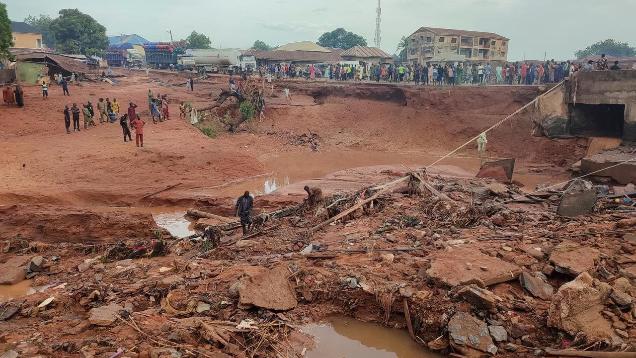 People search in flooded area following a downpour in Mokwa, Nigeria