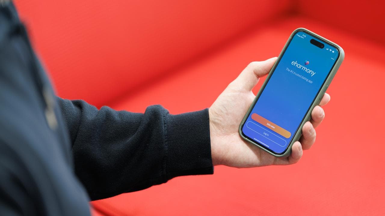 The eHarmony app is seen on a smartphone (file image)