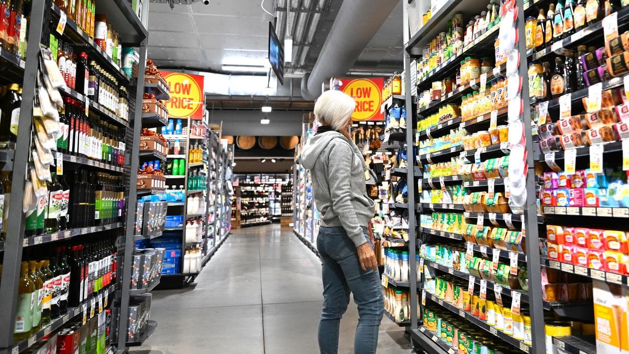 A woman is seen shopping at a supermarket