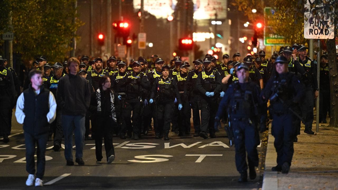 Police monitor Melbourne Victory fans.