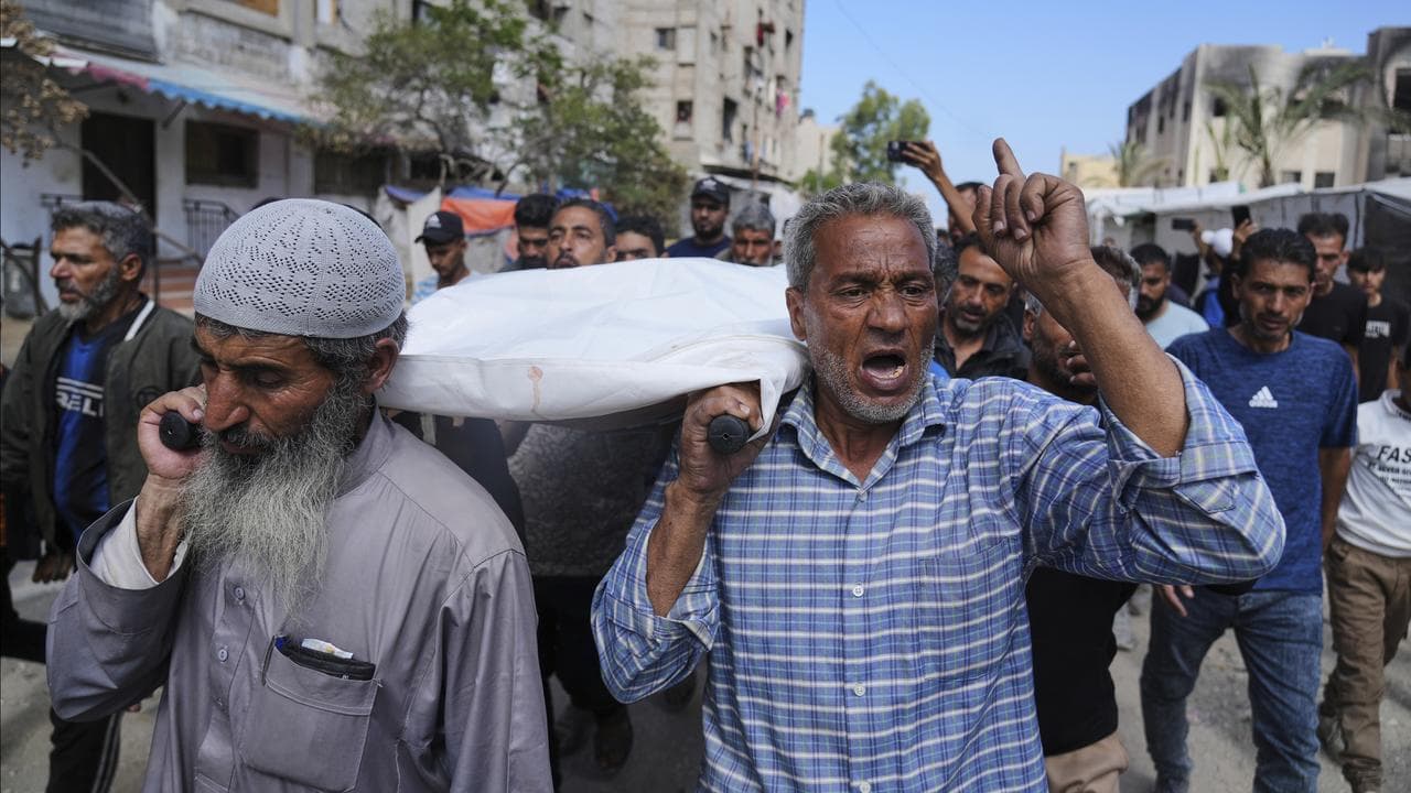 A funeral for a woman who was killed while heading to an aid hub