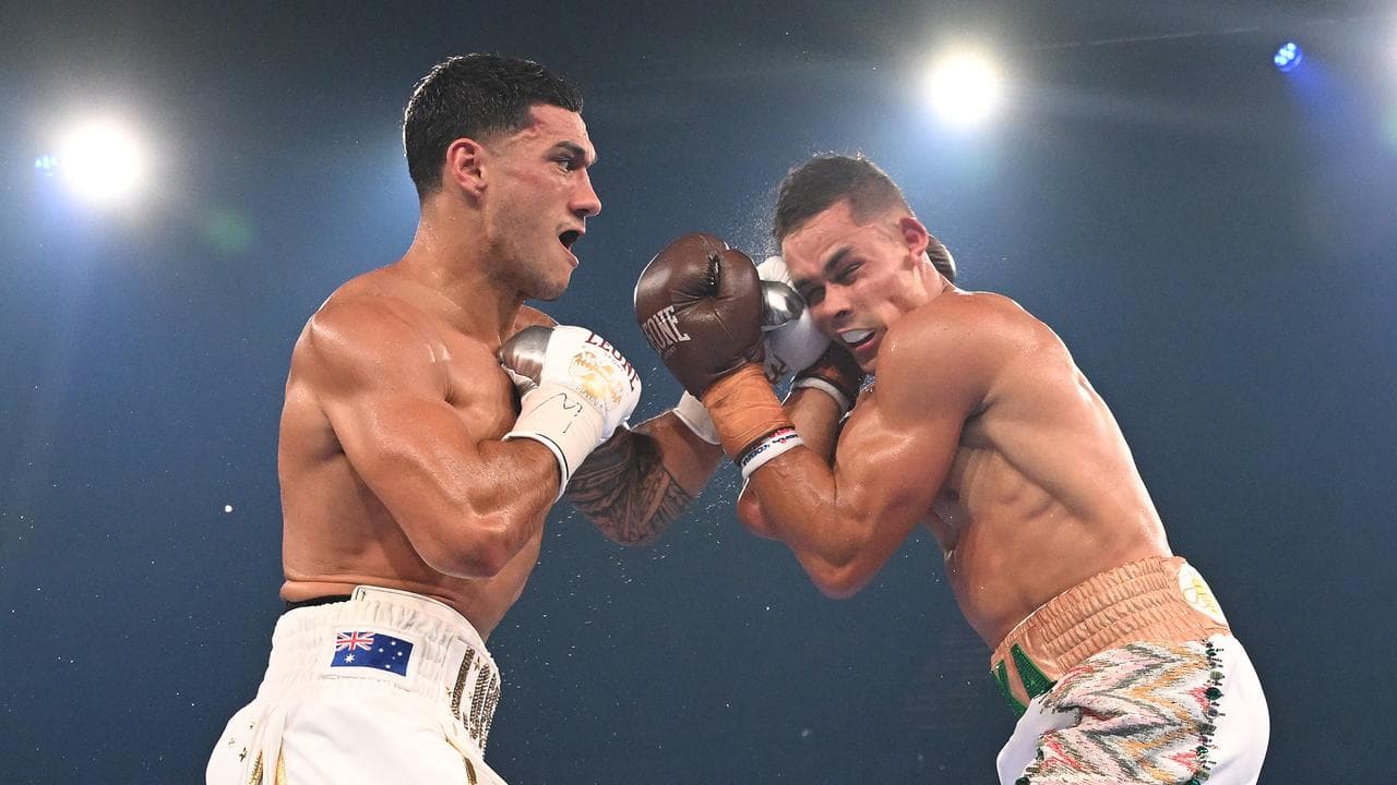 Jai Opetaia (left) hits David Nyika.