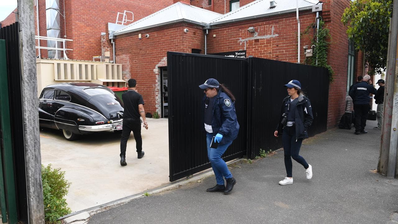 Police enter a property in Melbourne