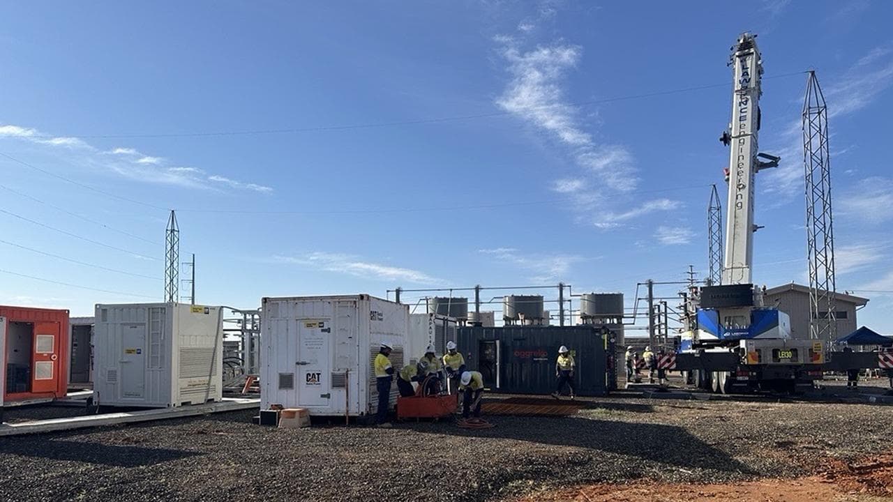 Workers repair a damaged electricity network
