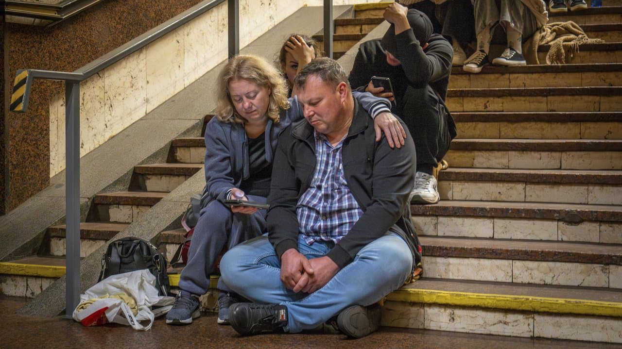 People in Kyiv seek shelter in a metro station