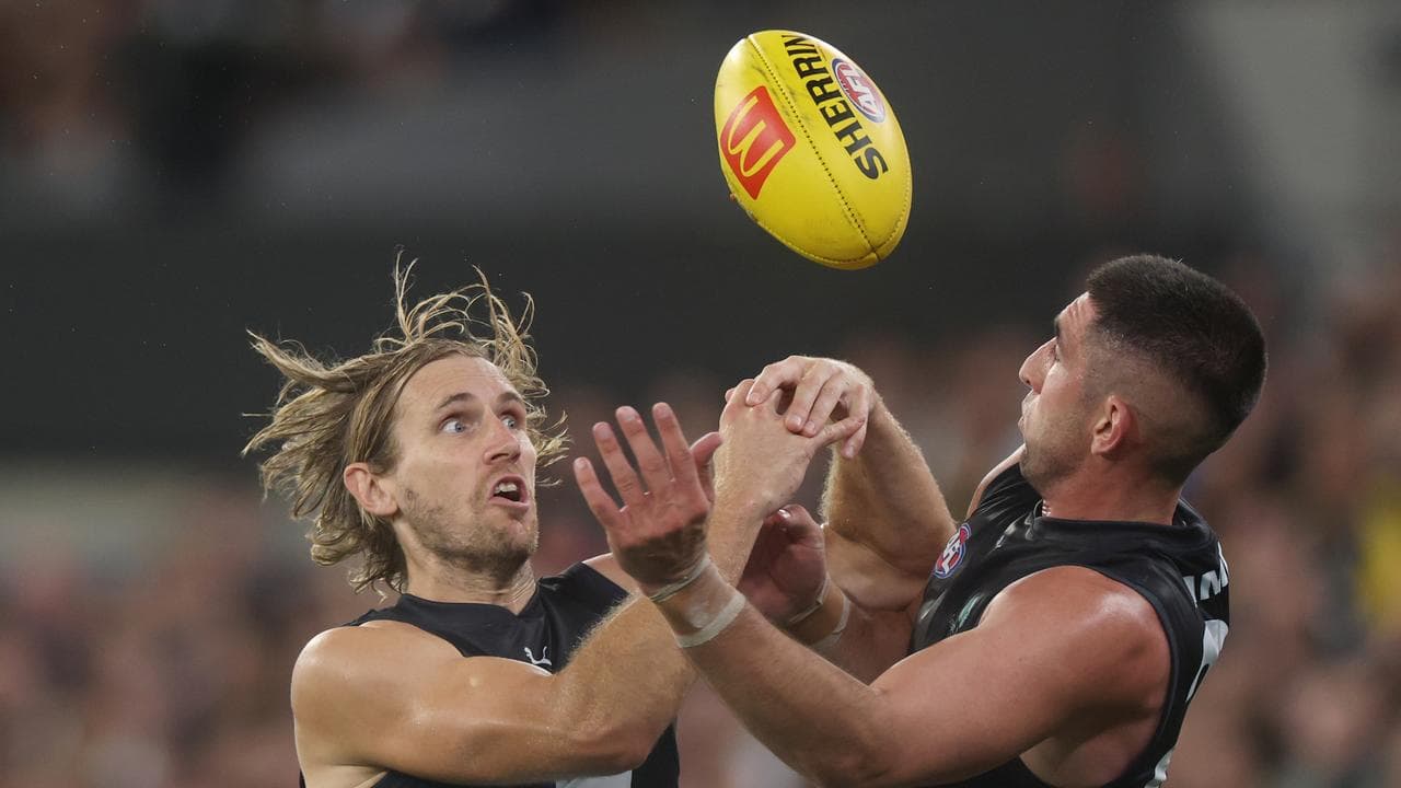 Nick Haynes of the Blues (left)