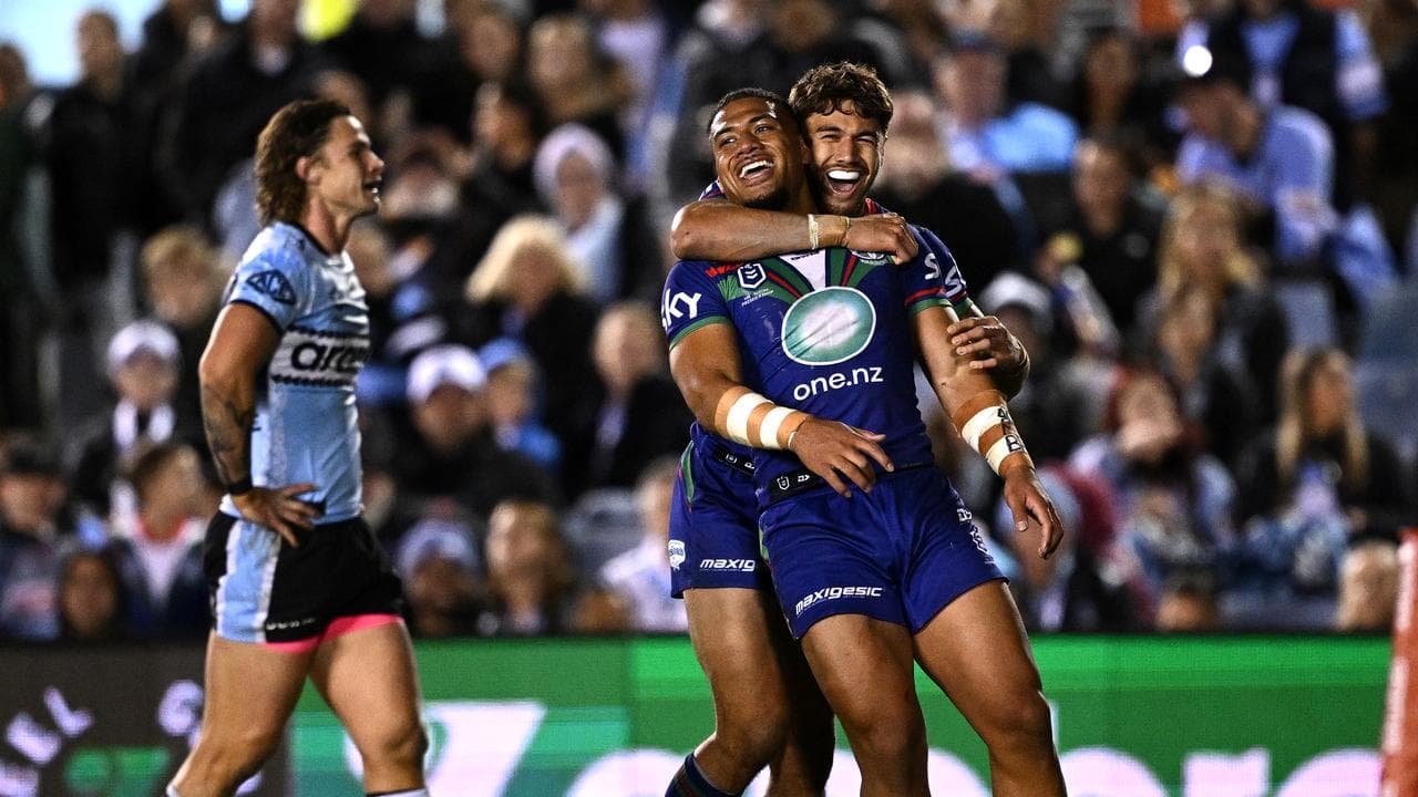 Leka Halasima and Chanel Harris-Tavita celebrate a try.