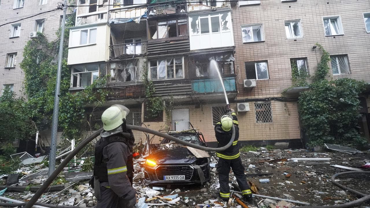 Firefighters tackle a blaze after a Russian attack