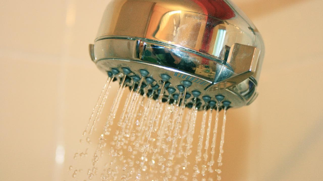 Water flowing from a showerhead