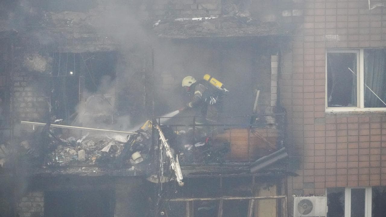 Firefighters tackle a blaze after a Russian attack