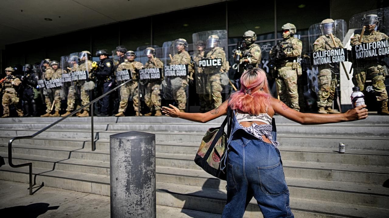 Protester taunts a line of California National Guard
