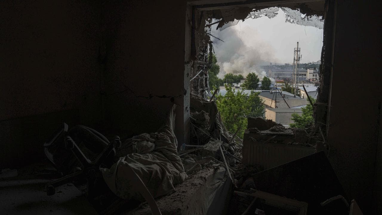 Smoke seen from window of apartment damaged by a Russian strike