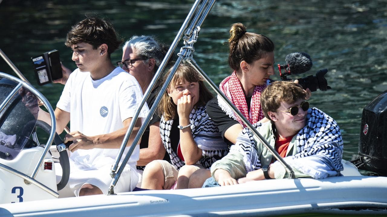 Greta Thunberg and others wait to board the Madleen boat