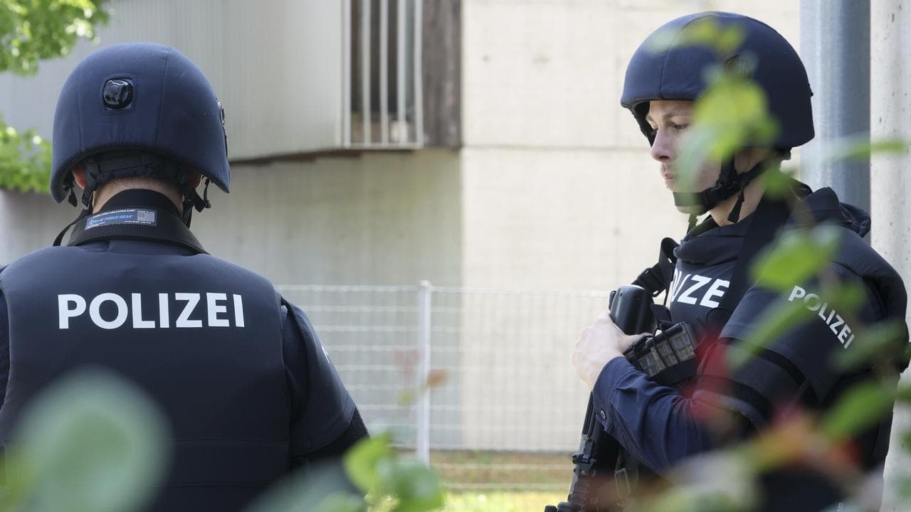 Police officers at the scene of a shooting in Graz
