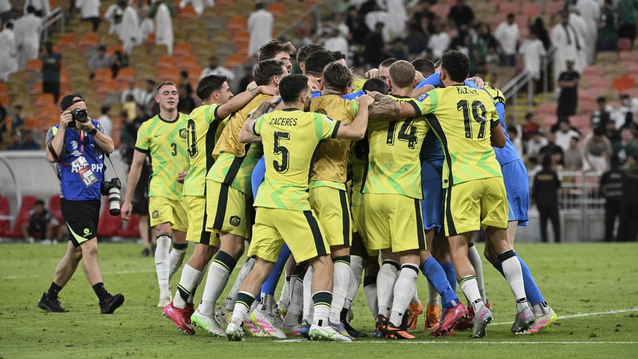 Australia players embrace