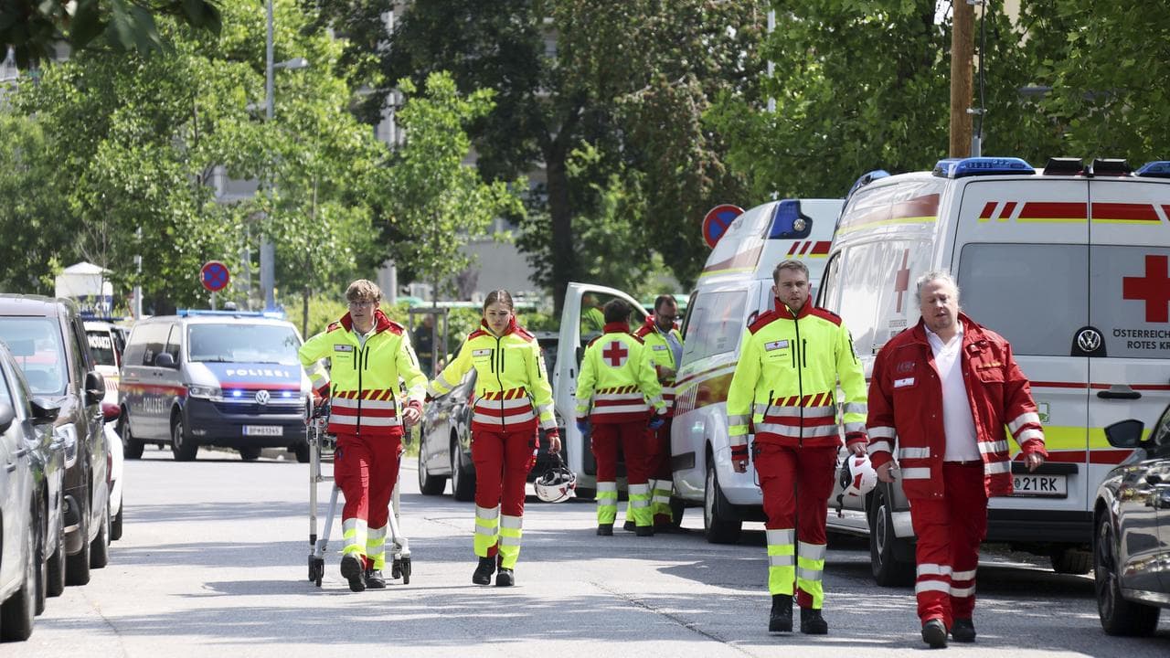 Rescue personnel at the scene of a shooting at a school in Graz