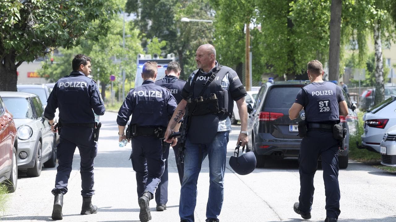 Police officers at the scene of a shooting at a school in Graz