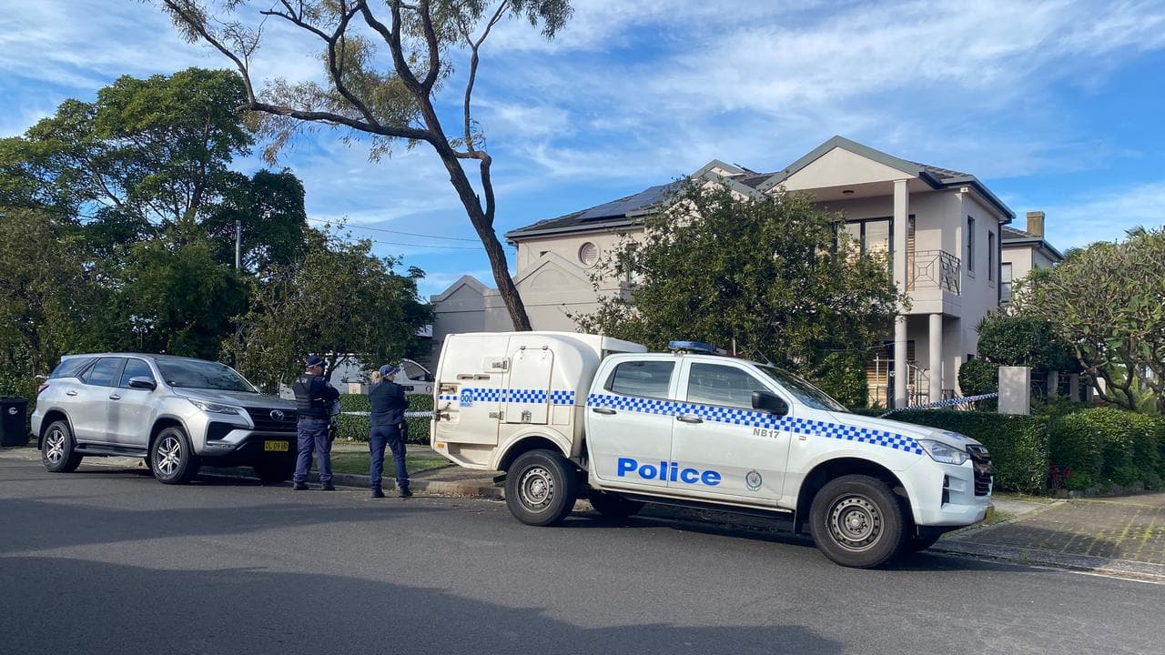 Police at the scene where two bodies were found