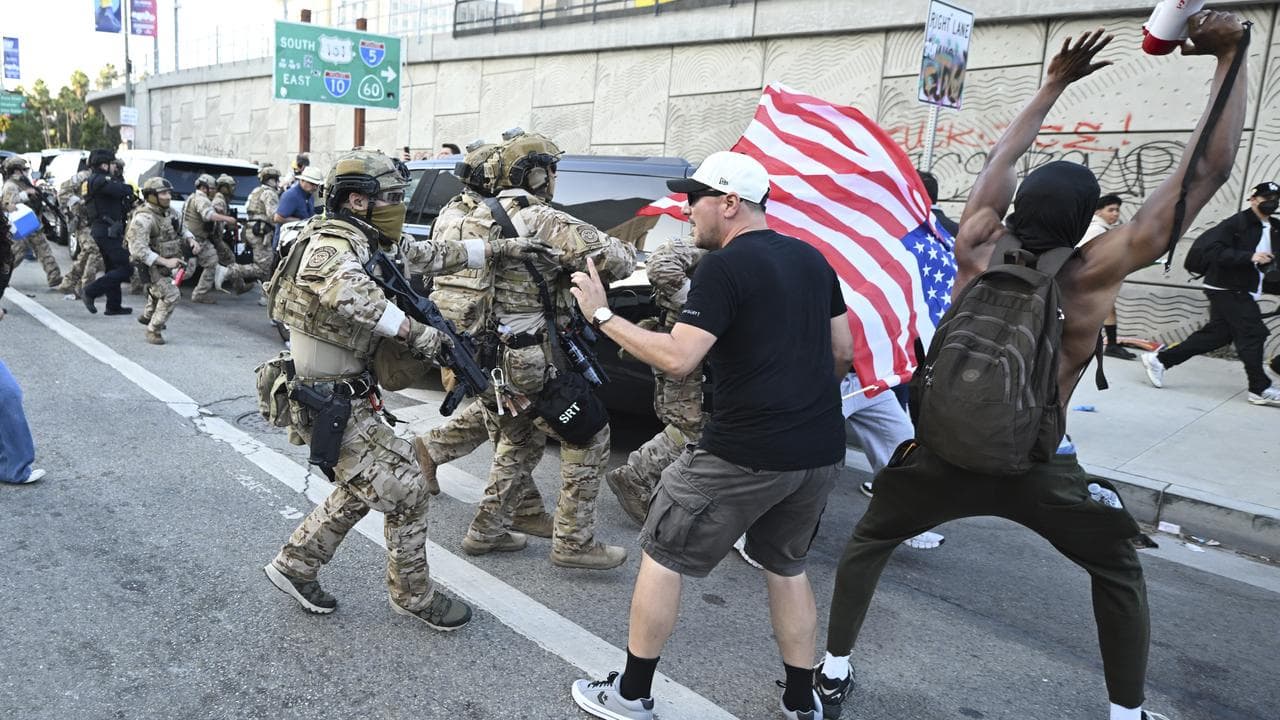 Demonstrators clash with members of US Border and Customs Protection