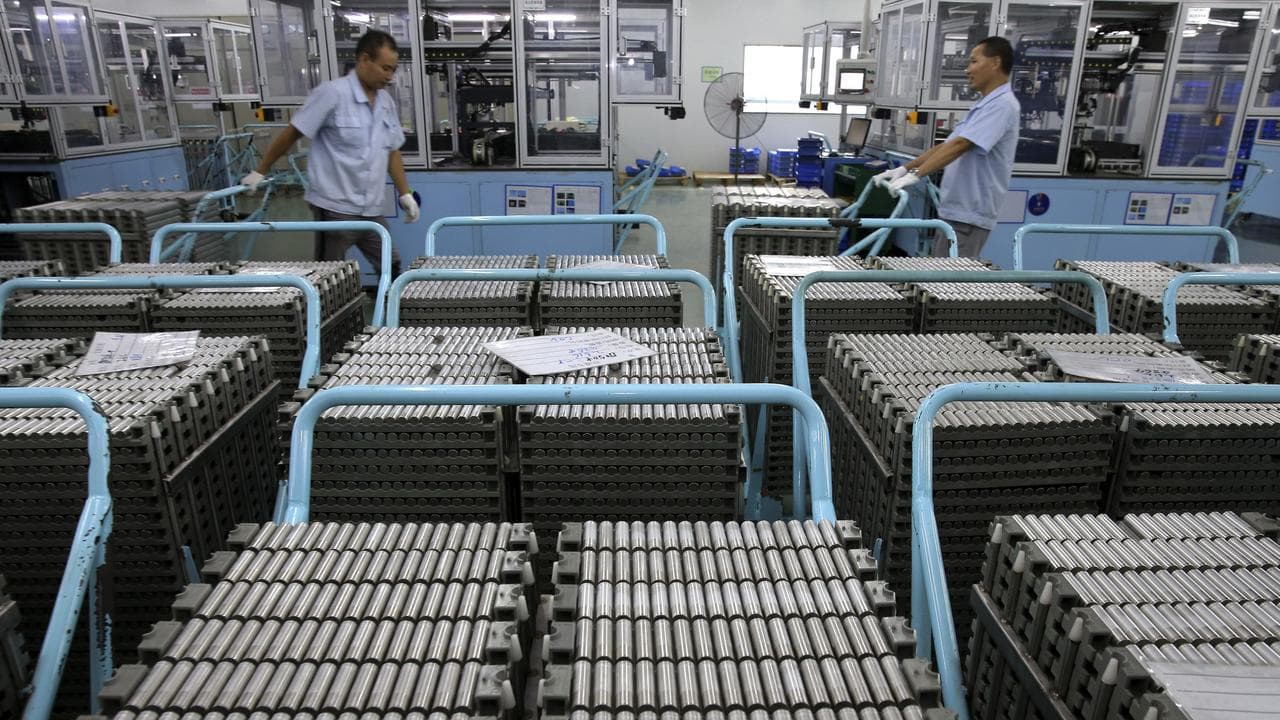 Workers transfer Lithium-ion batteries in Taizhou