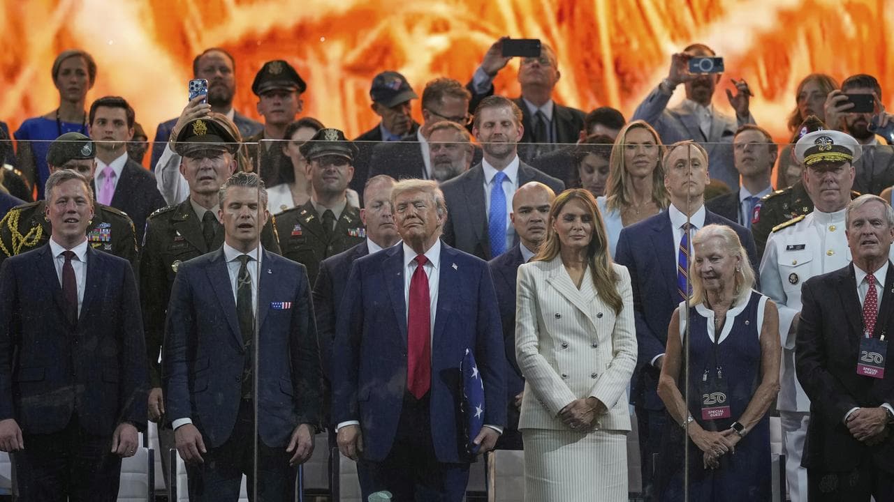 Donald Trump and first lady Melania Trump watching the parade