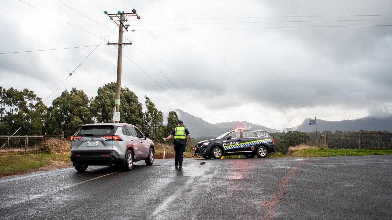 Police vehicles block traffic near the property (file image)