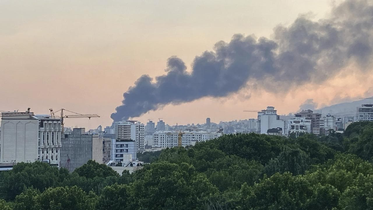 Smoke rises from the building in Tehran, Iran