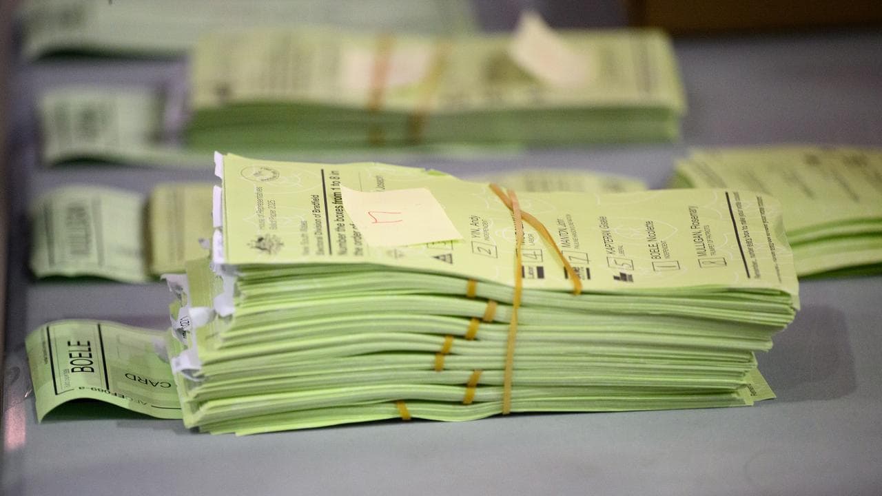 Australian Electoral Commission (AEC) representives recount ballots