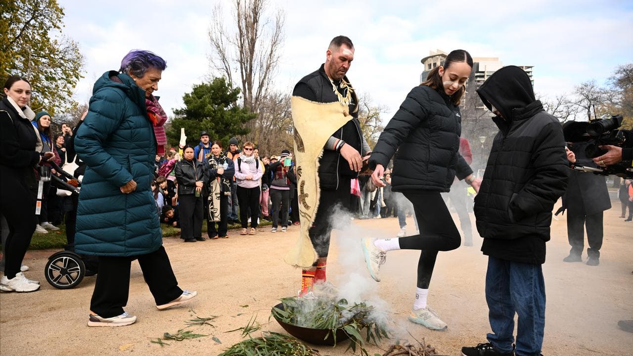 Travis Lovett  begins the day of the walk with a smoking ceremony