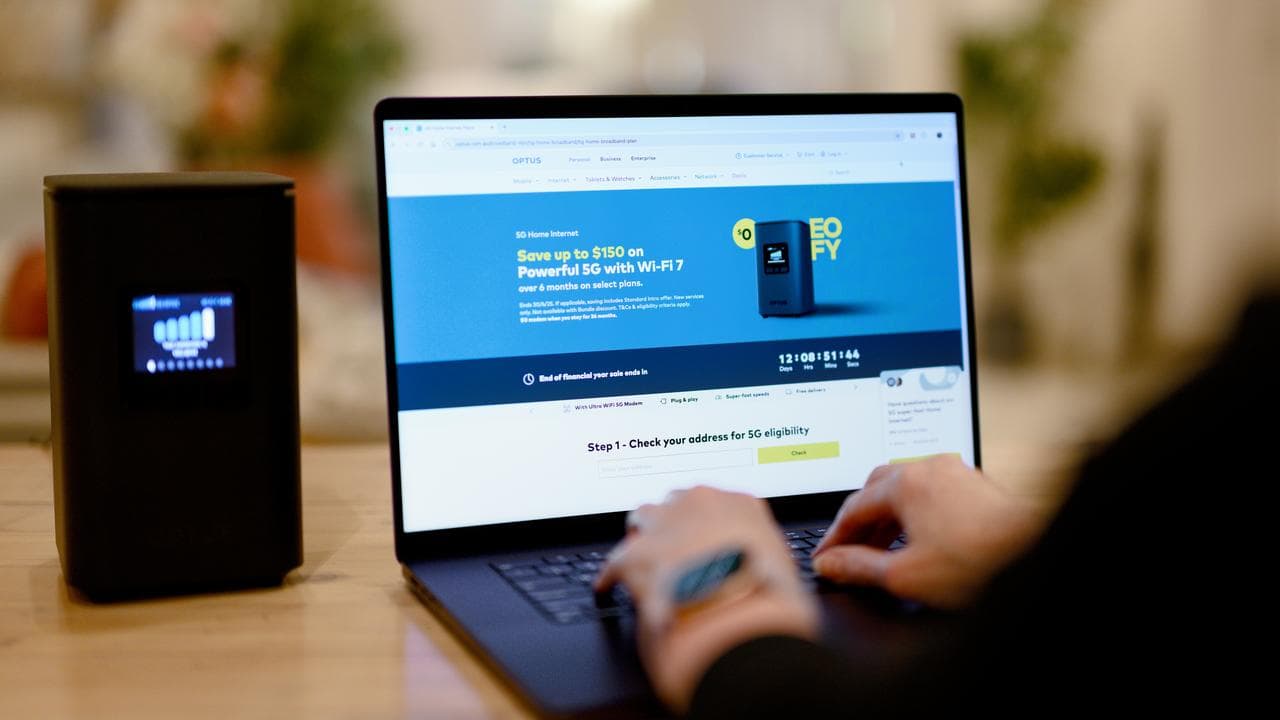 The Optus website on a laptop