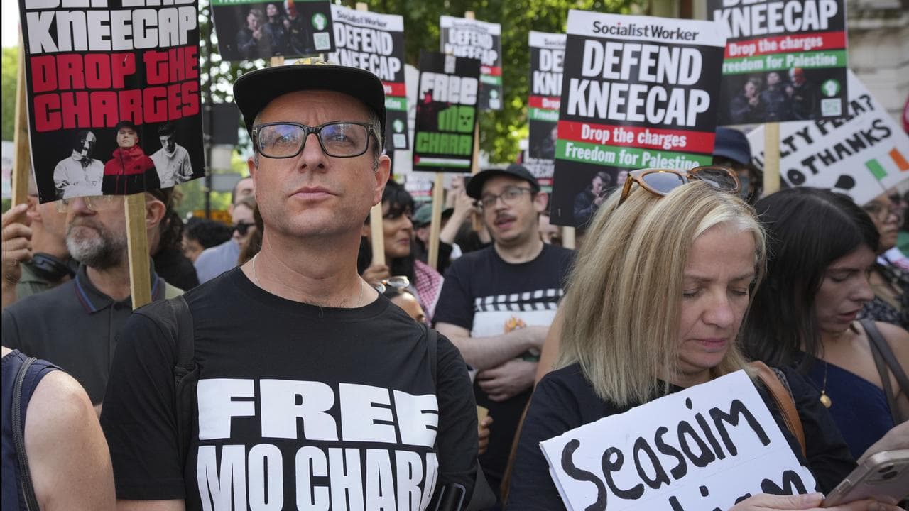 Supporters of Kneecap's Liam O'Hanna outside court in London