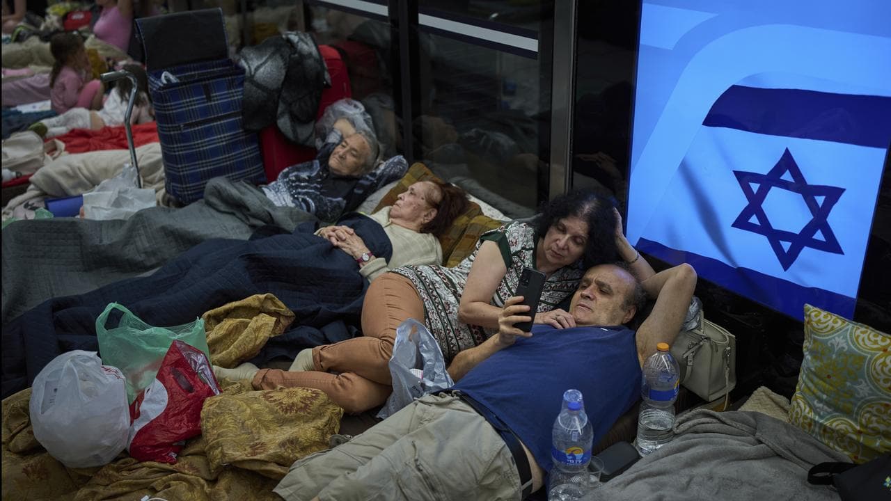 People shelter at a metro station near Tel Aviv
