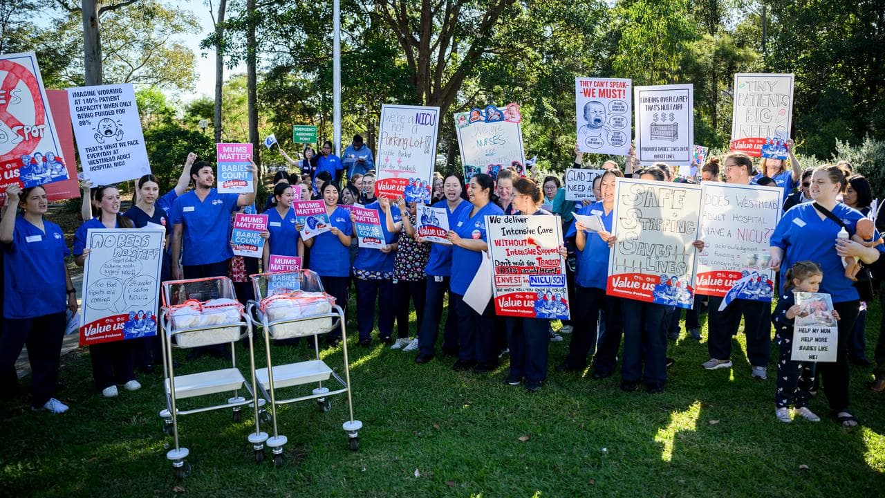 Westmead Hospital NICU nurses hold placards