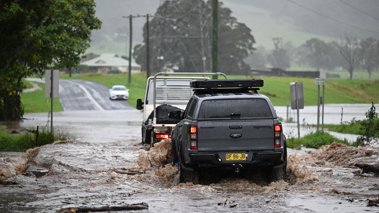 Cars make their way through floodwaters (file image)