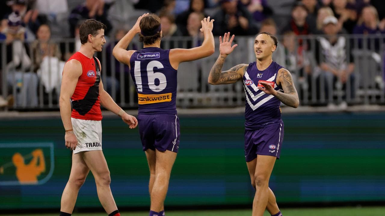 Murphy Reid (centre) and former Richmond star Shai Bolton.