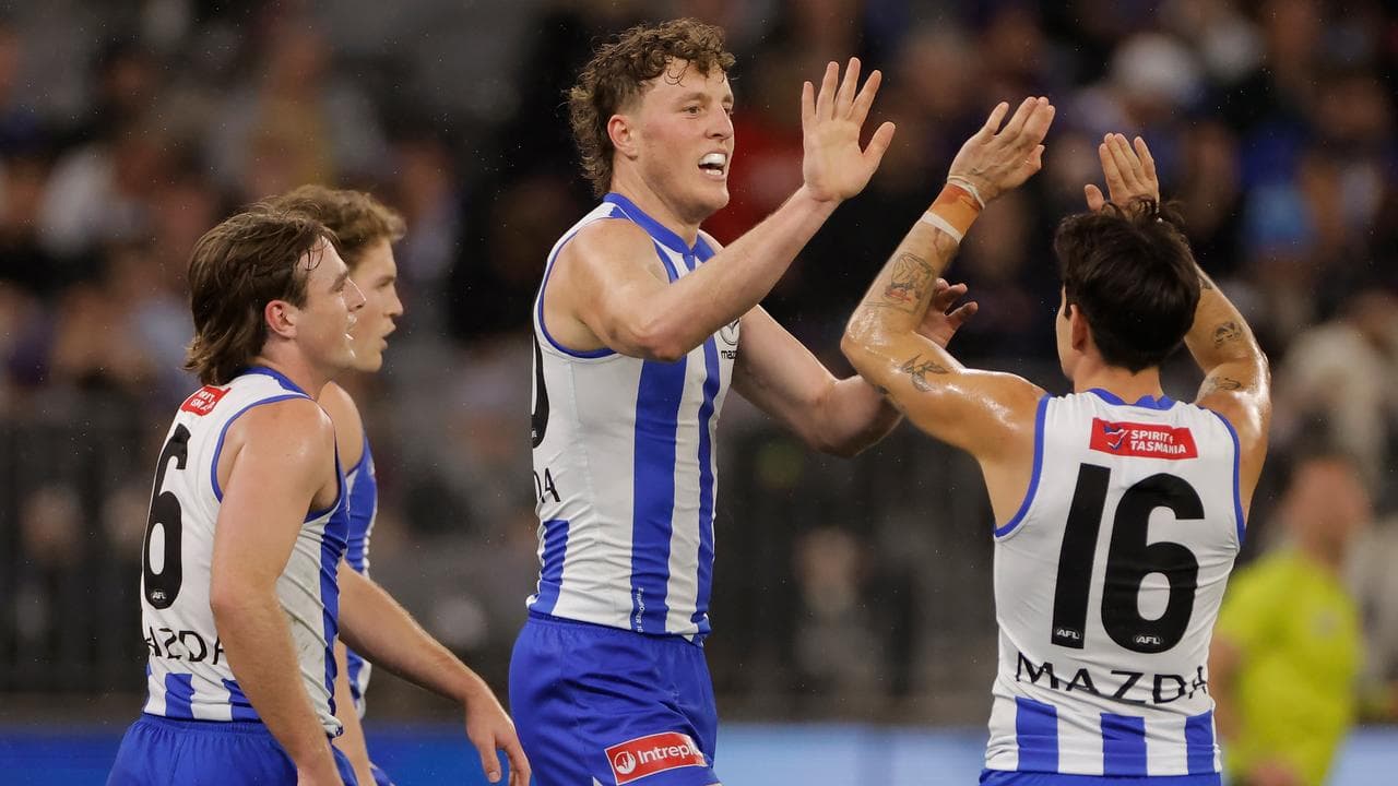 Celebrating North Melbourne Kangaroos players.