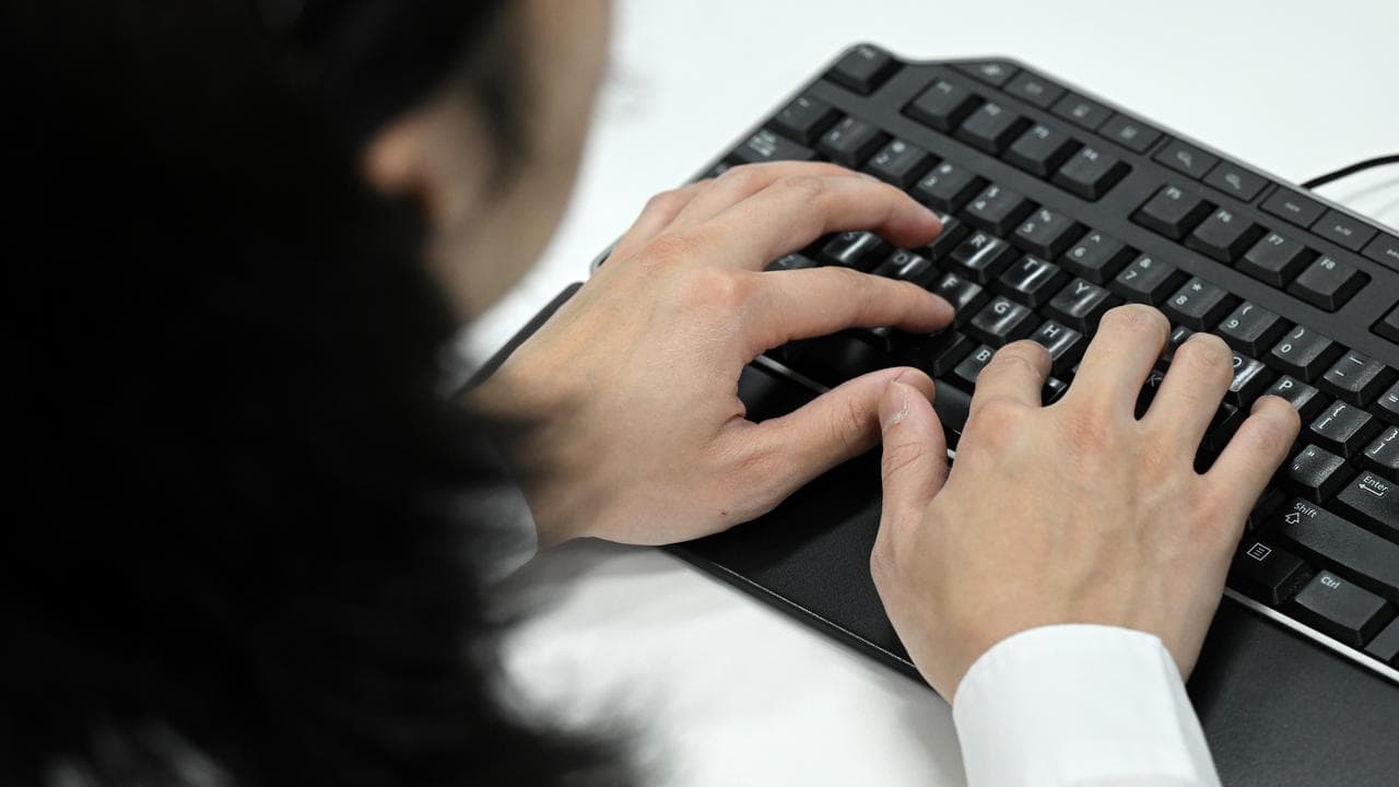 Person using a computer keyboard