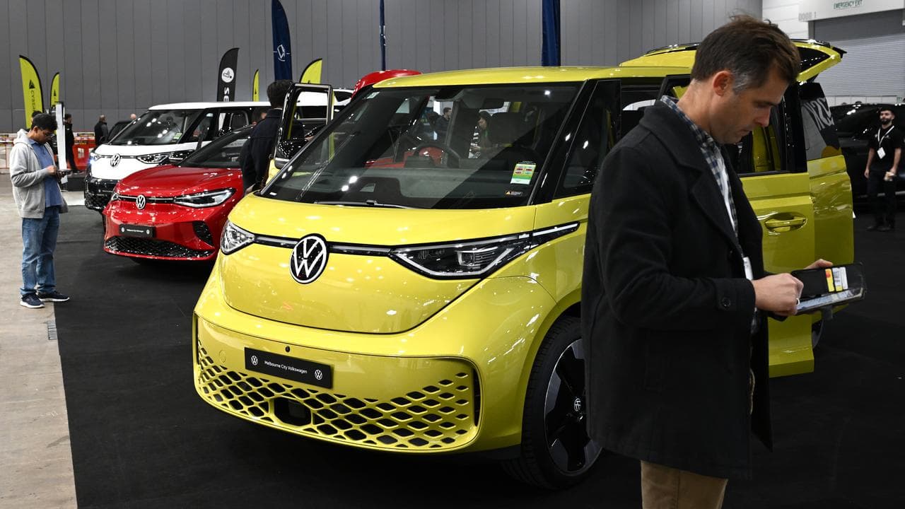 Visitors view vehicles during Melbourne International EV Autoshow