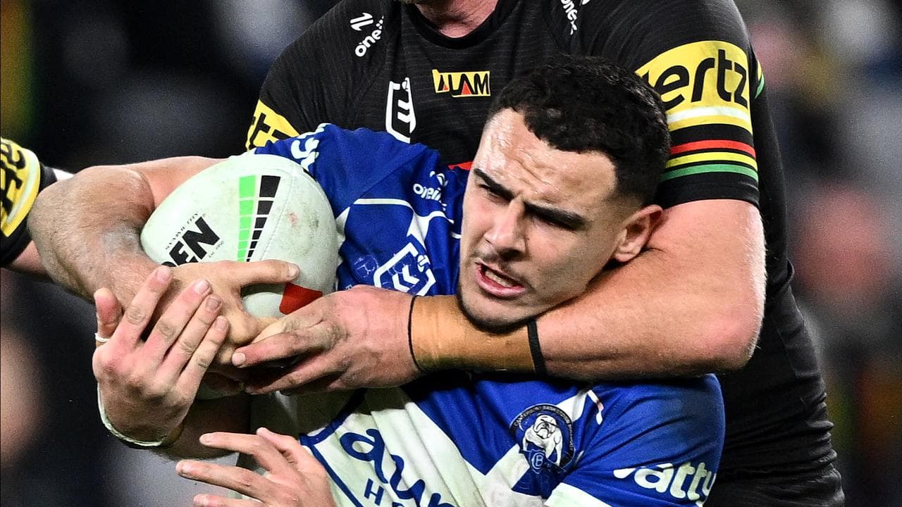 Jacob Kiraz tackled by Lindsay Smith.