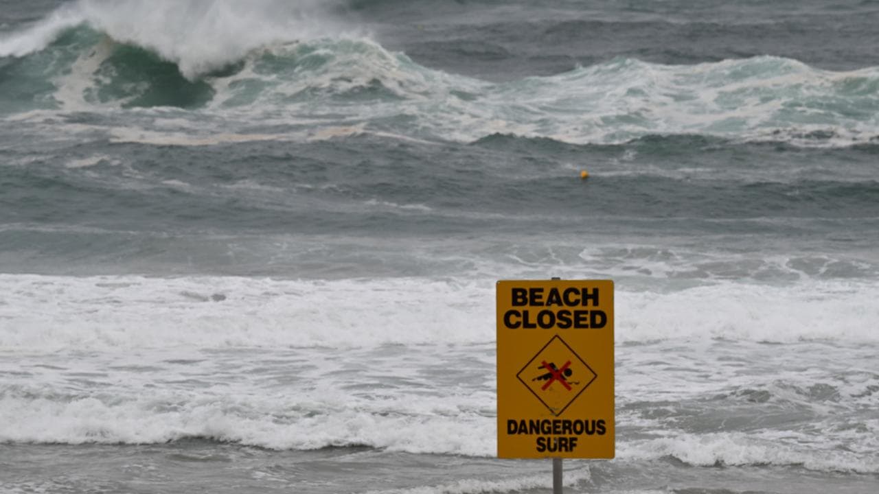 A beach is closed due to wild conditions