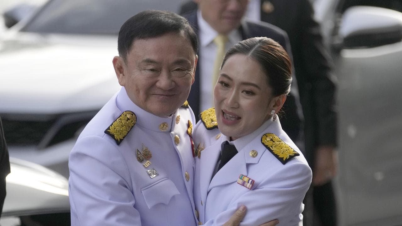 Thaksin Shinawatra hugs his daughter Paetongtarn Shinawatra