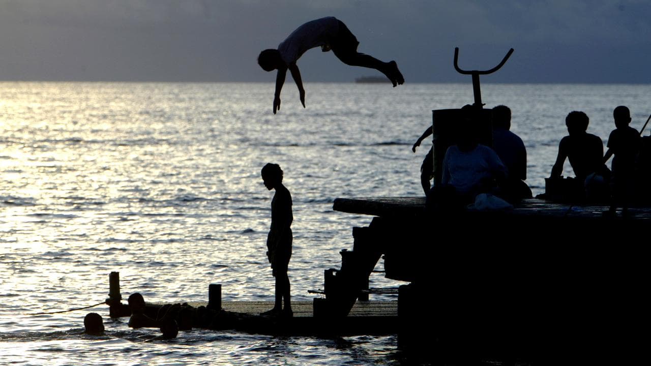 Children play at a lagoon near Funafuti