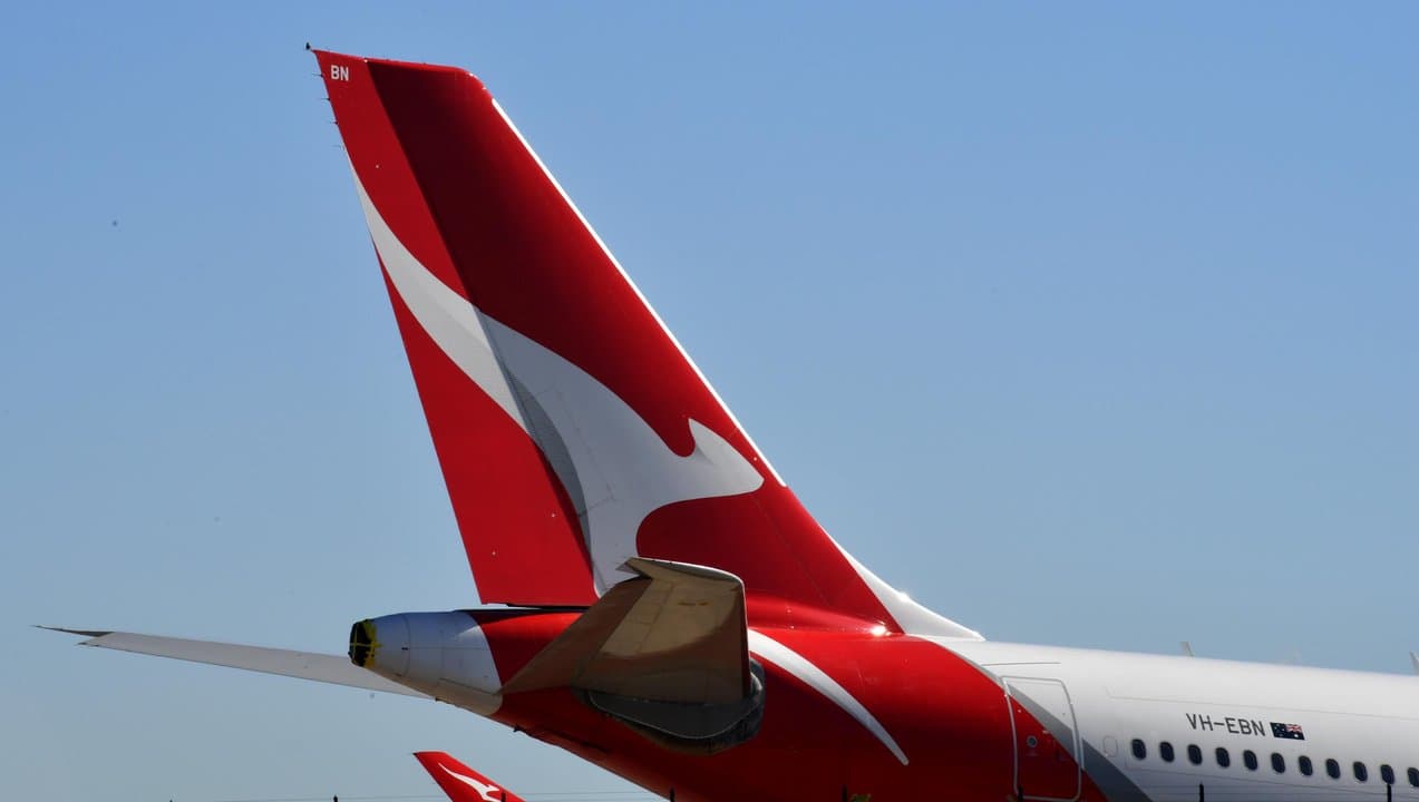 A QANTAS plane sits on the tarmac at Sydney Airport